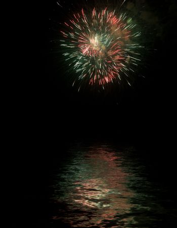 Very Colorfull Fireworks with reflexes on waterの写真素材