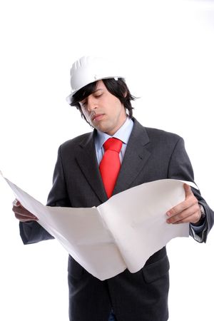 Young Engineer, reading a plan, isolated on whiteの写真素材