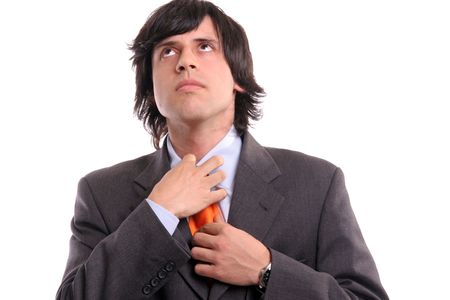 Detail of a man, fixing his tie - isolated in white backgroundの写真素材
