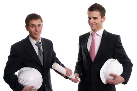 two business man with safety hats, exchanging a new project, isolated in white backgroundの写真素材