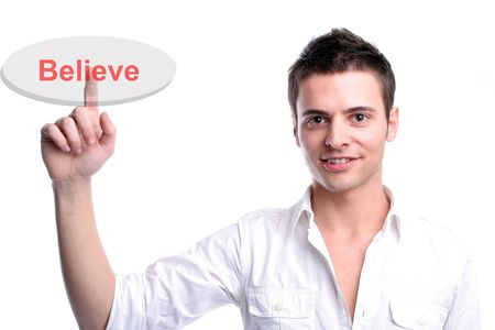 Young business man presses the believe key, isolated on white backgroundの写真素材