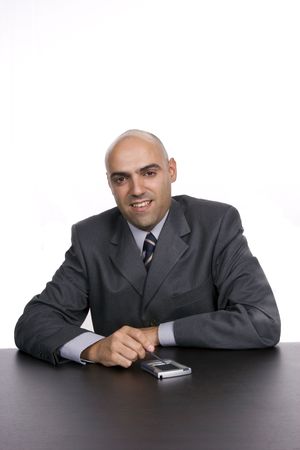 Young happy businessman, working at the desk, isolated on white backgroundの写真素材
