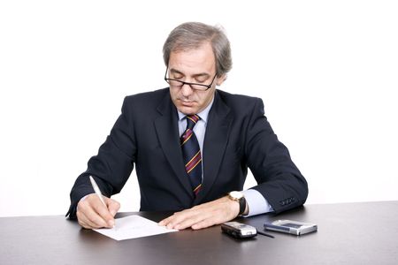 Mature businessman working, isolated over white backgroundの写真素材