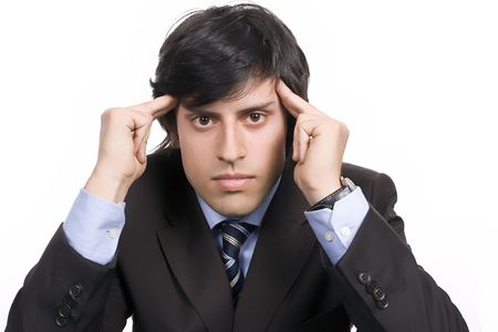 Young Businessman over a desk, full of thoughts, isolated in white backgroundの写真素材