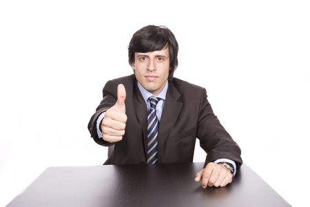 Happy businessman showing thumbs up, isolated in white backgroundの写真素材