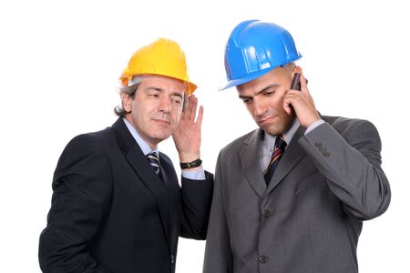 Two Engineers or Architects, on the phone, isolated in white backgroundの写真素材