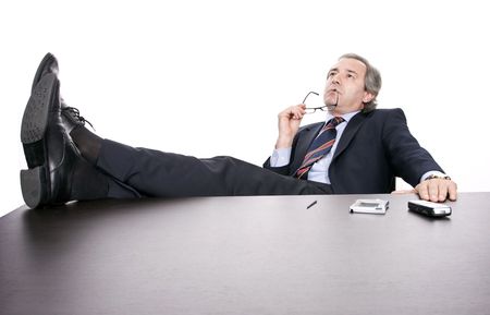 Mature businessman working, isolated over white backgroundの写真素材