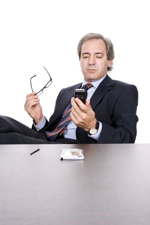 Mature businessman working, isolated over white backgroundの写真素材