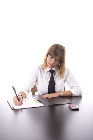 Young businesswoman at work, isolated over white backgroundの写真素材