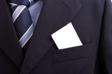 businessman with a blank business card in his pocket, isolated over whiteの写真素材