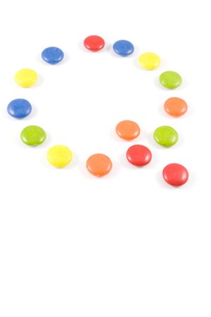 Letter Q made of colored smarties, isolated over whiteの写真素材