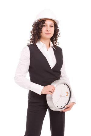 Young engineer holding a clock, isolated over whiteの写真素材
