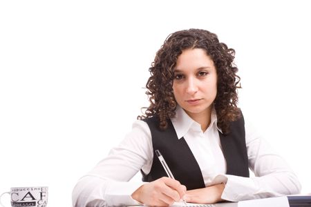 Young businesswoman at work, isolated over whiteの写真素材