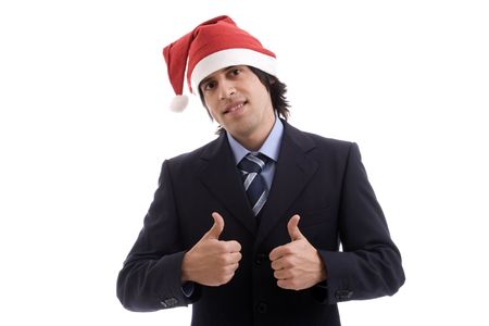 Businessman with Christmas hat showing thumbs upの写真素材