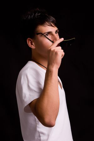 Young boy with sunglasses - low key portraitの写真素材