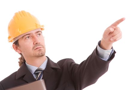 Engineer with yellow hat, pointing forward - isolated on whiteの写真素材