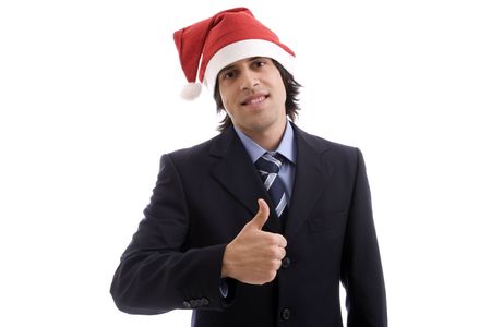 Businessman with Christmas hat showing thumb upの写真素材