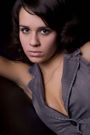 Young girl low key portrait - isolated on blackの写真素材