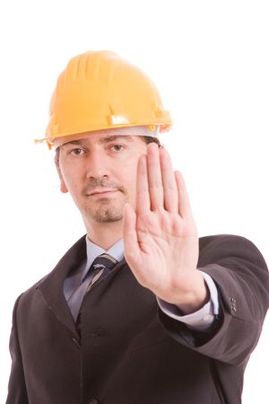 Engineer with yellow hat making stop signの写真素材