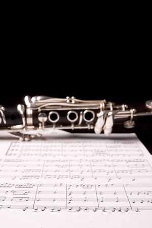 Clarinet over sheet music - selective focus on the sheet musicの写真素材