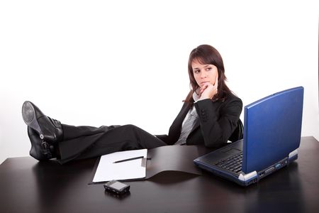 Business woman working with laptop, isolated over whiteの写真素材