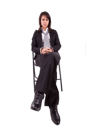 Beautiful business woman sitting on a chairの写真素材