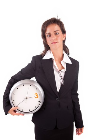 Business woman holding a clock, isolatedの写真素材