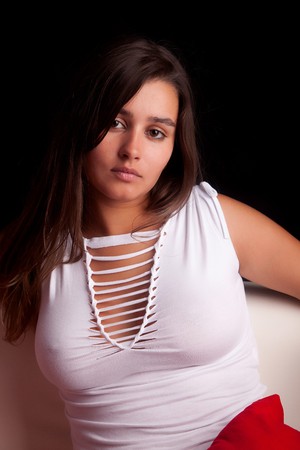 Young woman relaxing on couch - isolatedの写真素材