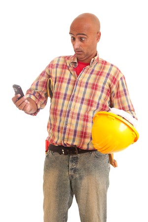 Construction worker at the phone, isolated over whiteの写真素材