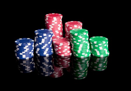 Pile of colored poker chipsの写真素材