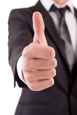 Business man showing thumb up - selective focus on handの写真素材