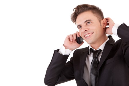 Business man at the phone, isolated over whiteの写真素材