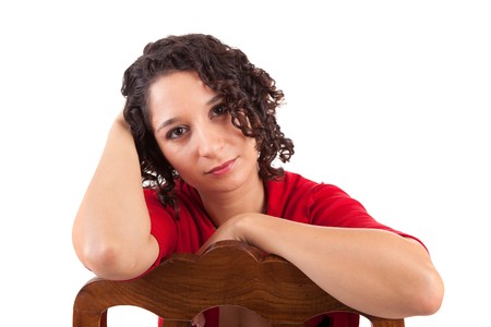 Beautiful woman sitting on a chair, isolatedの写真素材