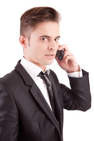 Business man at the phone, isolated over whiteの写真素材