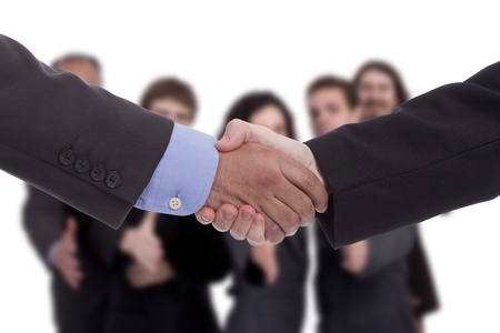 Handshake with business team in backgroundの写真素材