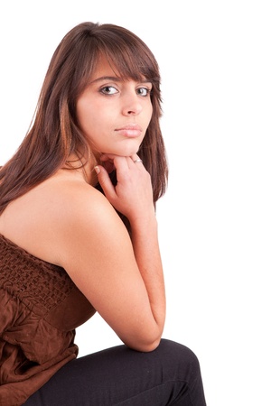 Beautiful woman sitting on a chair, isolatedの写真素材