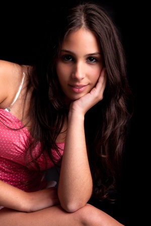 Beautiful woman sitting on a chair, isolatedの写真素材