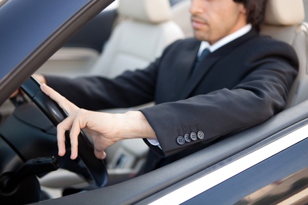 Young man in luxury sports carの写真素材