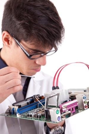 Computer engineer working on a old motherboardの写真素材
