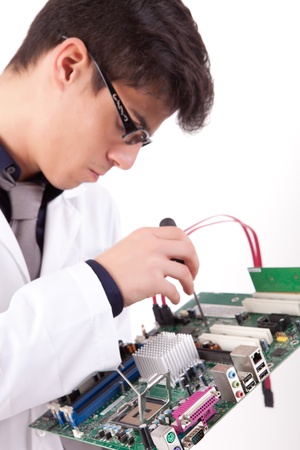 Computer engineer working on a old motherboardの写真素材