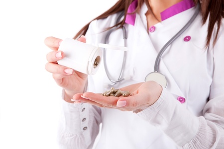 Young medic holding some pillsの写真素材