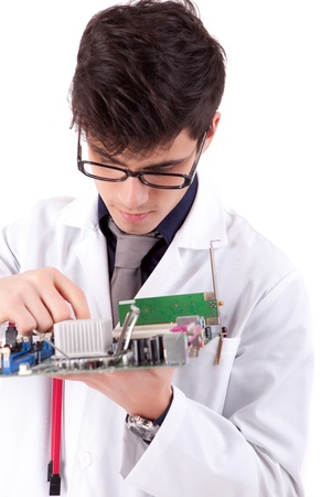 Computer engineer working on an old motherboardの写真素材