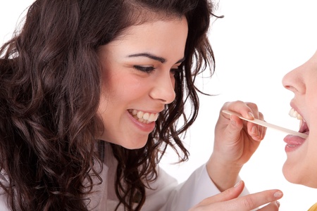 Young doctor examing a patientの写真素材