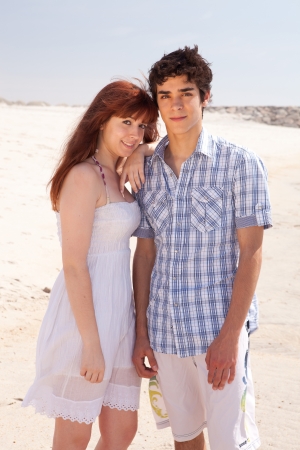 Young couple in love, relaxing at the beachの写真素材