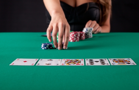 Very beautiful woman playing texas hold'em pokerの写真素材
