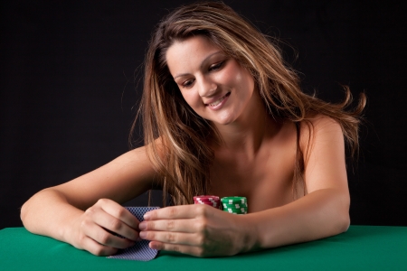 Very beautiful woman playing texas hold'em pokerの写真素材