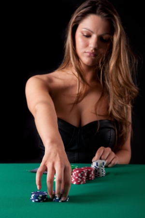 Very beautiful woman playing texas hold'em pokerの写真素材