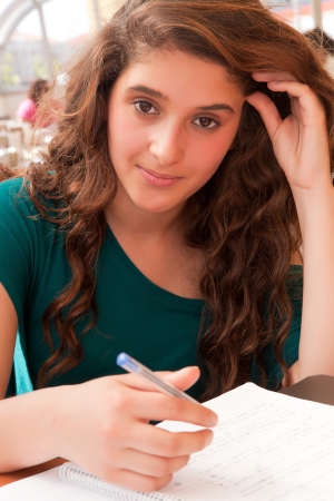 Young girl studying at esplanadeの写真素材