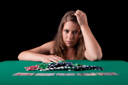 Very beautiful woman playing texas hold'em pokerの写真素材
