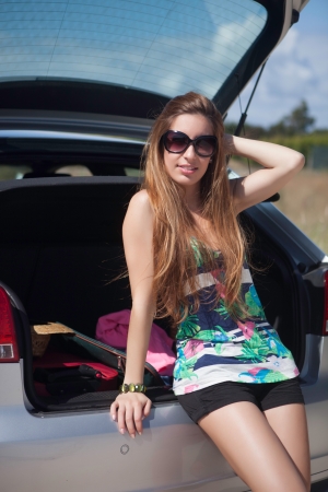 Young happy woman leaving for vacationsの写真素材